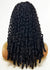 Black human hair wig on a mannequin head against a white background